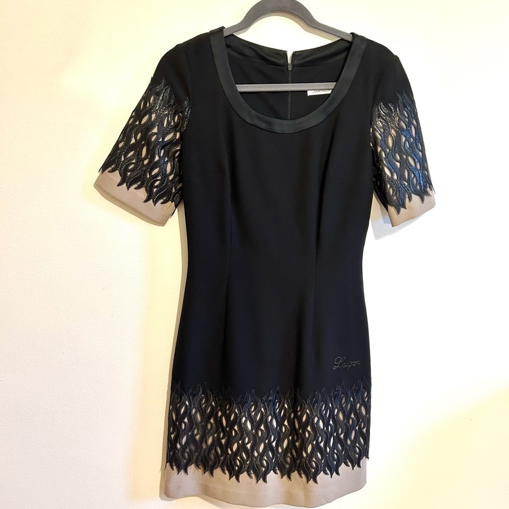 Black dress with leather detail and nude lining